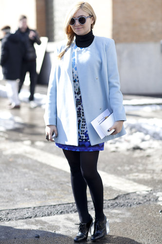 A mod moment with a sweet coat and bold print — even on her shades.
A mod moment with a sweet coat and bold print — even on her shades.