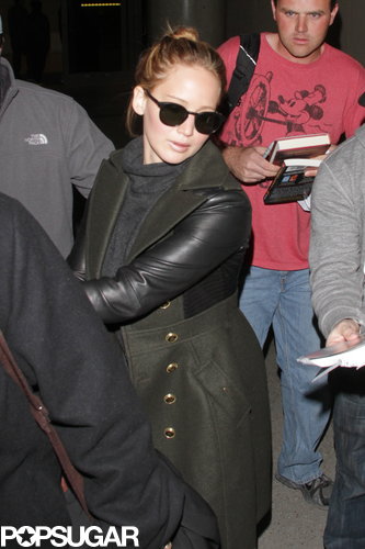 Jennifer Lawrence Gets the Giggles While Flying Home With Her Teddy Jennifer Lawrence Gets the Giggles While Flying Home With Her Teddy