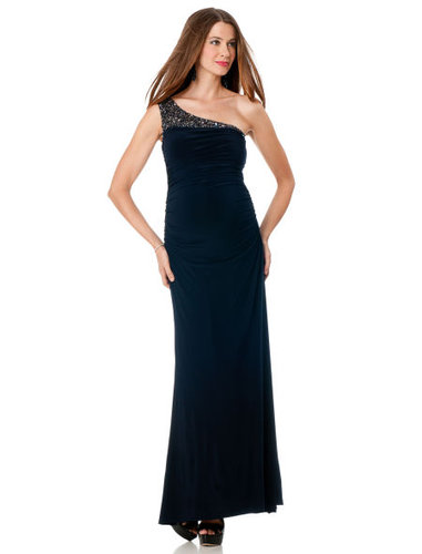 PS: I have a black-tie wedding coming up in a couple of months and am clueless about what to wear. Any suggestions?
OCM: Traditional black-tie necessitates a long evening gown. For expecting moms, that is actually great news because long gowns create a long and slimming silhouette. I recommend choosing a dress that is made with spandex or material with a give, so that it cascades over your belly down to the floor, which is really flattering. Make sure the hem is a few inches from the floor. I would choose a gown that is understated, and play up the look with some fun accessories that also help to balance out your new figure. I love the idea of a simple black or navy jersey gown with chic chandelier earrings and cuff bracelets.
JS Boutique Embellished Dress ($150, originally $200)
PS: I have a black-tie wedding coming up in a couple of months and am clueless about what to wear. Any suggestions?
OCM: Traditional black-tie necessitates a long evening gown. For expecting moms, that is actually great news because long gowns create a long and slimming silhouette. I recommend choosing a dress that is made with spandex or material with a give, so that it cascades over your belly down to the floor, which is really flattering. Make sure the hem is a few inches from the floor. I would choose a gown that is understated, and play up the look with some fun accessories that also help to balance out your new figure. I love the idea of a simple black or navy jersey gown with chic chandelier earrings and cuff bracelets.
JS Boutique Embellished Dress ($150, originally $200)