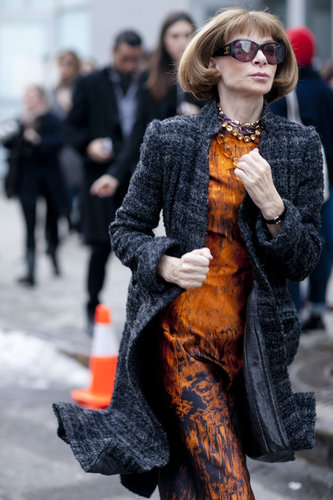 Anna Wintour made a stylish run around the tents in tweed and an abstract-print sheath.
Anna Wintour made a stylish run around the tents in tweed and an abstract-print sheath.