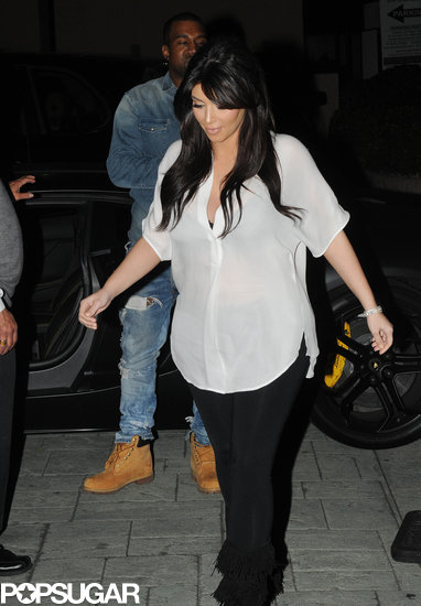Kim Kardashian covered her baby bump with a sheer white blouse for a Valentine's date with boyfriend Kanye West.
Kim Kardashian covered her baby bump with a sheer white blouse for a Valentine's date with boyfriend Kanye West.