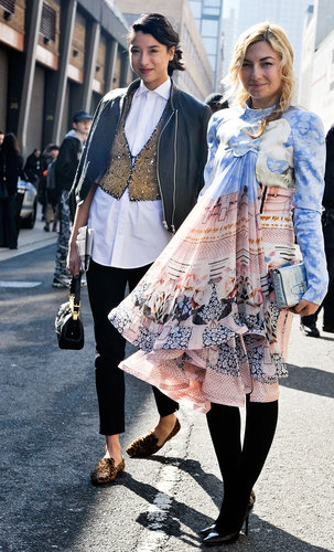 Lily Kwong outfitted a classic white button-down with an embellished vest and loafers, while her fellow show-goer made a statement in a soft, printed babydoll dress.
Lily Kwong outfitted a classic white button-down with an embellished vest and loafers, while her fellow show-goer made a statement in a soft, printed babydoll dress.