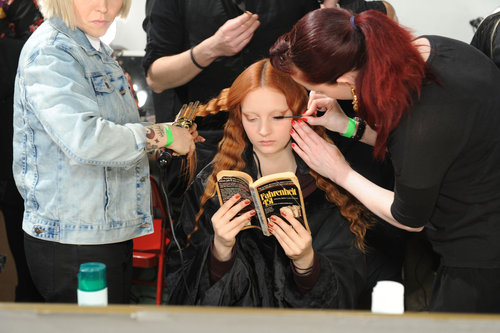 A model read Fahrenheit 451 while getting primped backstage at the Creatures of the Wind Fall 2013 fashion show during Mercedes-Benz Fashion Week in New York.
A model read Fahrenheit 451 while getting primped backstage at the Creatures of the Wind Fall 2013 fashion show during Mercedes-Benz Fashion Week in New York.