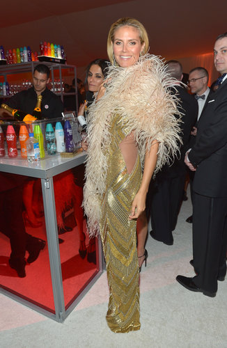 Heidi Klum wrapped herself in a feather boa at Elton John's Oscar party.
Heidi Klum wrapped herself in a feather boa at Elton John's Oscar party.
