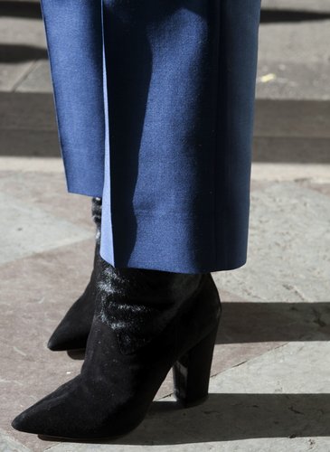 Black boots provided sharp contrast against blue trousers.
Black boots provided sharp contrast against blue trousers.