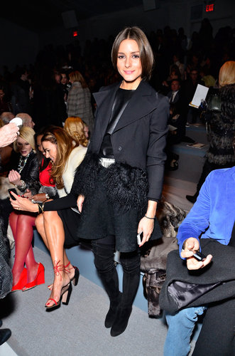 Olivia donned a cropped fur-trim jacket by Armani, a leather top, and a textured skater skirt at Dennis Basso.
Olivia donned a cropped fur-trim jacket by Armani, a leather top, and a textured skater skirt at Dennis Basso.