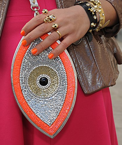 From the shimmery clutch to the black and gold jewels, we can't stop staring at this dazzling accessory pairing.
From the shimmery clutch to the black and gold jewels, we can't stop staring at this dazzling accessory pairing.