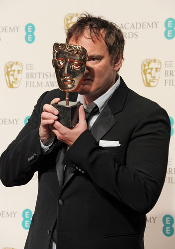 Quentin Tarantino played around with his BAFTA Award for best original screenplay in the press room.
Quentin Tarantino played around with his BAFTA Award for best original screenplay in the press room.