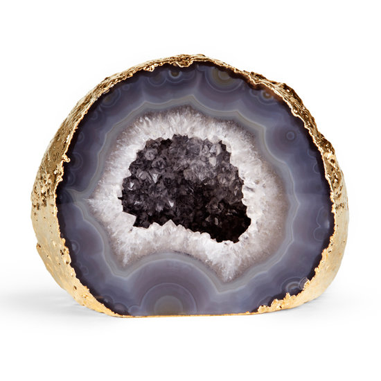 Add unique, earthy elegance to a side table or bookshelf with this gold-rimmed gray agate geode ($150).
Add unique, earthy elegance to a side table or bookshelf with this gold-rimmed gray agate geode ($150).