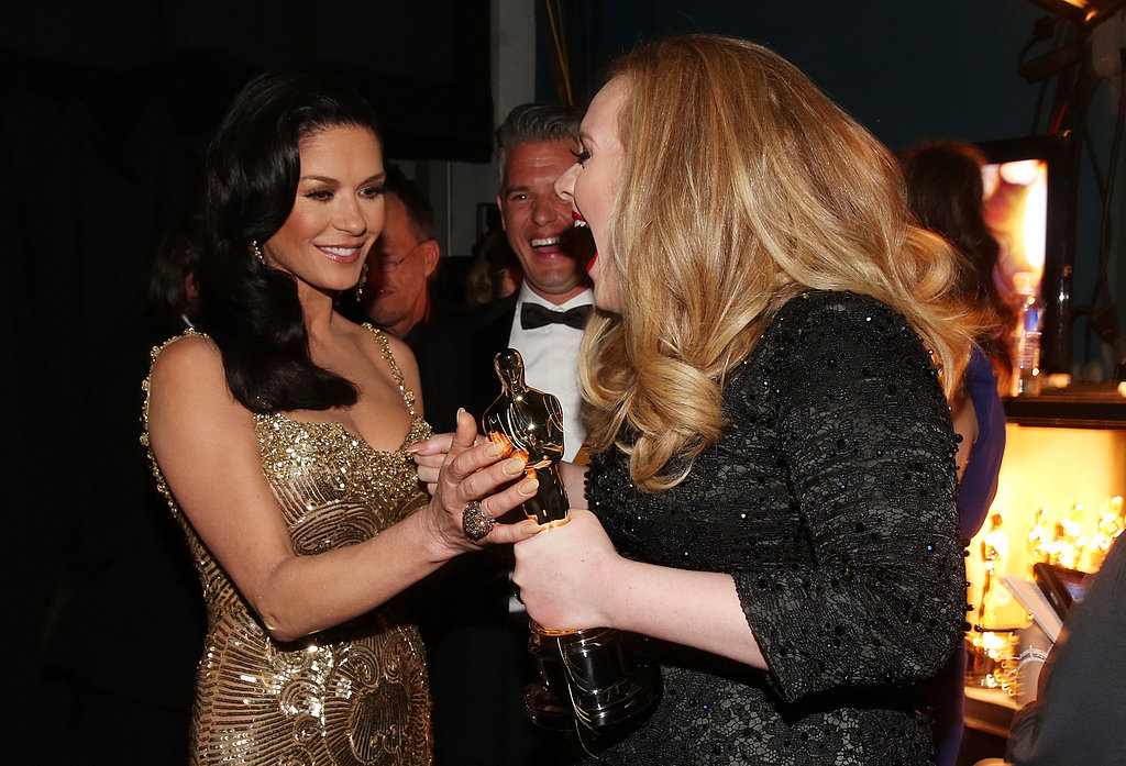 Adele celebrated her win with Catherine Zeta-Jones at the Oscars.
Adele celebrated her win with Catherine Zeta-Jones at the Oscars.