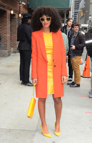 While out in NYC, Solange Knowles took bright to a whole other level in a yellow sheath dress, topped with an orange coat and finished with yellow pumps, a yellow wristlet, and gold glittery Miu Miu sunglasses.
While out in NYC, Solange Knowles took bright to a whole other level in a yellow sheath dress, topped with an orange coat and finished with yellow pumps, a yellow wristlet, and gold glittery Miu Miu sunglasses.