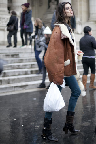 The tough-girl model uniform in full effect with an oversize suede jacket and biker boots.
The tough-girl model uniform in full effect with an oversize suede jacket and biker boots.