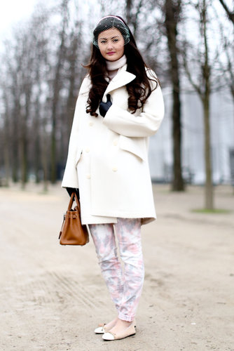 Sweet, soft florals and a creamy white coat play into the ladylike feel of her delicate veil.
Sweet, soft florals and a creamy white coat play into the ladylike feel of her delicate veil.