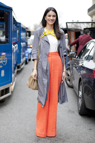 A bow-tied necklace married perfectly with the tangerine color of her trousers — equal parts ladylike and a little playful.
A bow-tied necklace married perfectly with the tangerine color of her trousers — equal parts ladylike and a little playful.