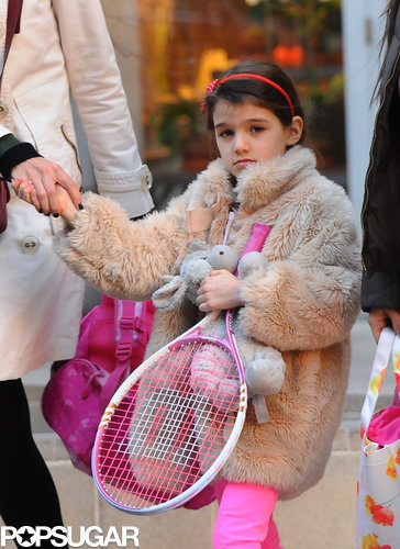 Suri Picks Up a Pink Racket For Tennis With Katie Holmes Suri Picks Up a Pink Racket For Tennis With Katie Holmes