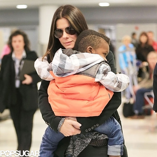 Sandra Bullock Lands in NYC With Little Louis Sandra Bullock Lands in NYC With Little Louis