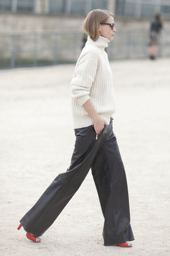 This showgoer gave leather pants a chic makeover with a classic turtleneck.
This showgoer gave leather pants a chic makeover with a classic turtleneck.