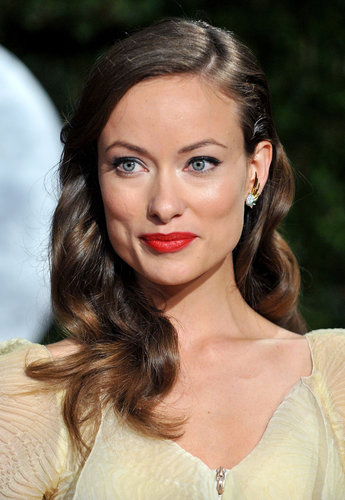 Olivia was stunning on the red carpet at the 2010 Vanity Fair Oscars party. Her look had a vintage spin with sideswept waves, red lips, and glimmering eye makeup.
Olivia was stunning on the red carpet at the 2010 Vanity Fair Oscars party. Her look had a vintage spin with sideswept waves, red lips, and glimmering eye makeup.