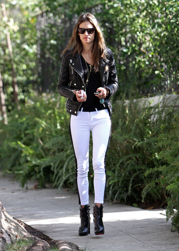 Alessandra Ambrosio kept her color palette black and white in Hudson tuxedo jeans, a black leather biker jacket, Christian Louboutin buckle booties, and Westward Leaning sunglasses during a stroll in LA.
Alessandra Ambrosio kept her color palette black and white in Hudson tuxedo jeans, a black leather biker jacket, Christian Louboutin buckle booties, and Westward Leaning sunglasses during a stroll in LA.