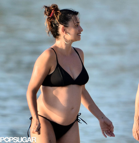 Penélope Cruz showed off her baby bump in a black bikini.
Penélope Cruz showed off her baby bump in a black bikini.
