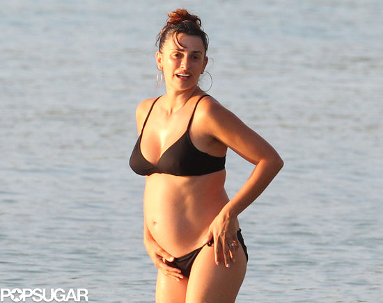 Penélope Cruz showed off her baby bump in a black bikini. Penélope Cruz showed off her baby bump in a black bikini.