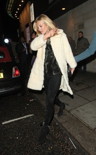 Kate topped her dark nighttime ensemble with a bright, furry ivory coat in London.
Kate topped her dark nighttime ensemble with a bright, furry ivory coat in London.