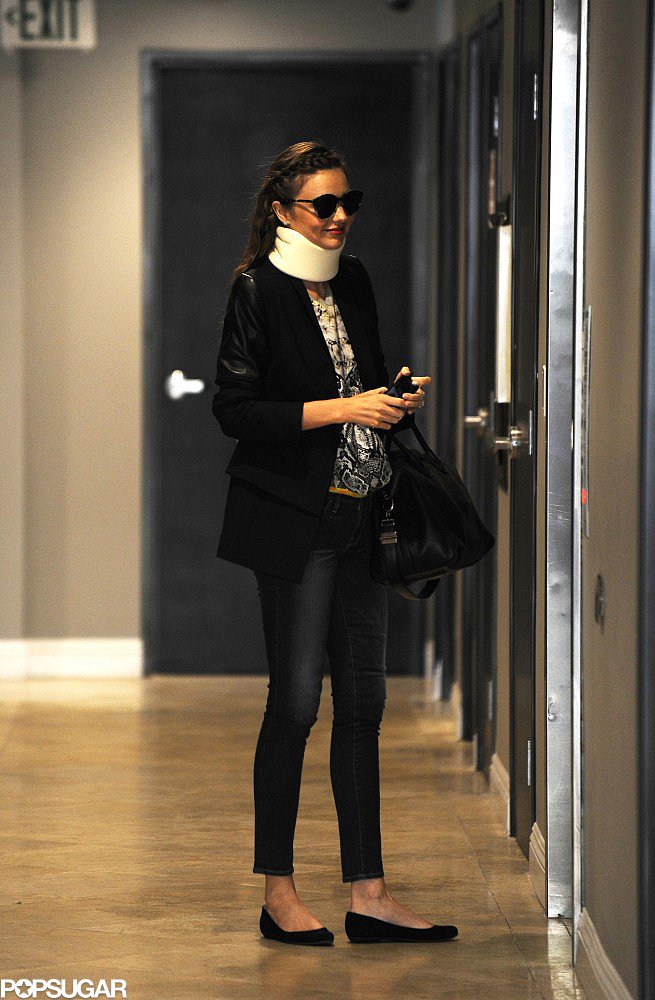 Miranda Kerr wore a neck brace in LA. Miranda Kerr wore a neck brace in LA.