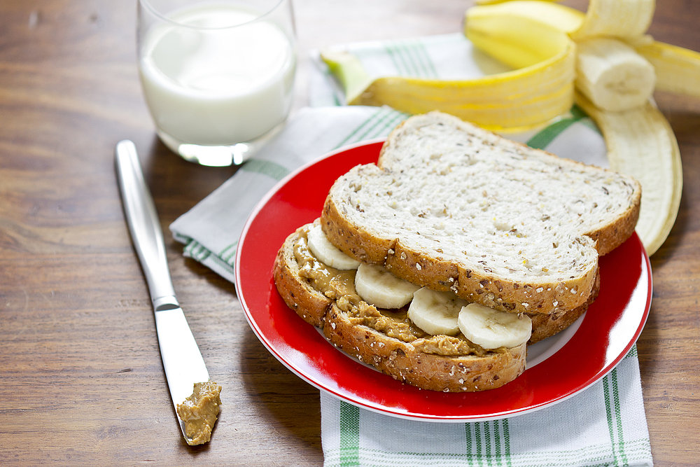If they like: Peanut butter and jelly sandwiches
Try: Almond butter, drizzled with honey, and sliced banana
Whether it's for a morning or afternoon snack, PB & J sandwiches are the ultimate go-to snack. Make them even more appealing health-wise by substituting almond butter for peanut butter and swapping sugary jelly for honey and sliced bananas — you'll lose no time in the process.
If they like: Peanut butter and jelly sandwiches
Try: Almond butter, drizzled with honey, and sliced banana
Whether it's for a morning or afternoon snack, PB & J sandwiches are the ultimate go-to snack. Make them even more appealing health-wise by substituting almond butter for peanut butter and swapping sugary jelly for honey and sliced bananas — you'll lose no time in the process.