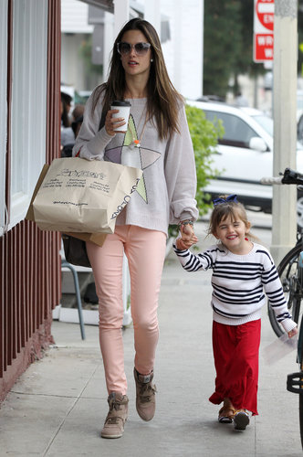 Alessandra Ambrosio worked salmon-pink jeans with Ash wedge sneakers and a star-print sweater while on mommy duty in LA.
Alessandra Ambrosio worked salmon-pink jeans with Ash wedge sneakers and a star-print sweater while on mommy duty in LA.