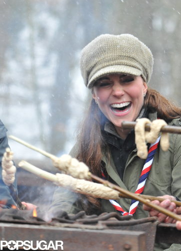 Kate Middleton laughed over a fire.
Kate Middleton laughed over a fire.