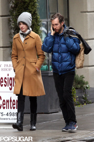 Anne Hathaway walked next to Adam Shulman while he took a call.
Anne Hathaway walked next to Adam Shulman while he took a call.