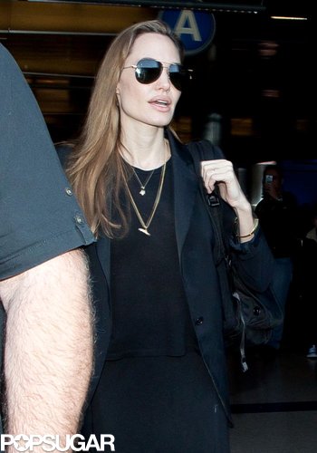 Angelina Denies Wedding Ring Rumors Upon Returning to LA Angelina Denies Wedding Ring Rumors Upon Returning to LA