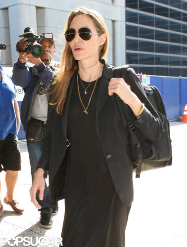 Angelina Denies Wedding Ring Rumors Upon Returning to LA Angelina Denies Wedding Ring Rumors Upon Returning to LA