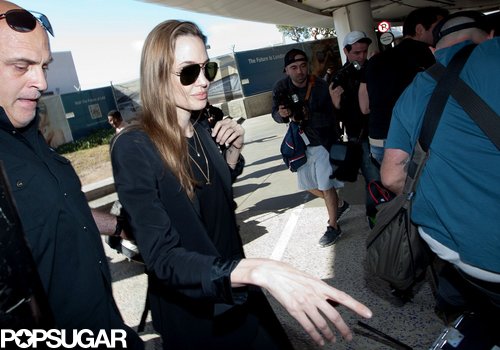 Angelina Denies Wedding Ring Rumors Upon Returning to LA Angelina Denies Wedding Ring Rumors Upon Returning to LA
