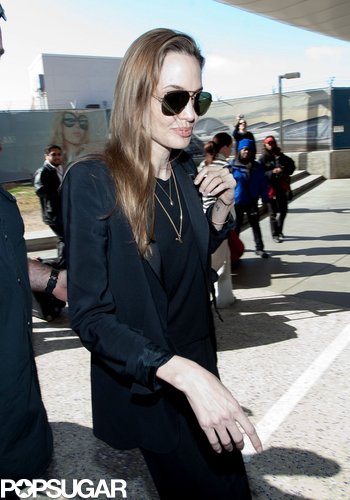 Angelina Denies Wedding Ring Rumors Upon Returning to LA Angelina Denies Wedding Ring Rumors Upon Returning to LA