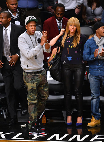 At a New York Knicks game in November 2012, Jay-Z showed off camouflage pants while Beyoncé paired Stella McCartney's alphabet top with leather pants and cobalt pumps.
At a New York Knicks game in November 2012, Jay-Z showed off camouflage pants while Beyoncé paired Stella McCartney's alphabet top with leather pants and cobalt pumps.