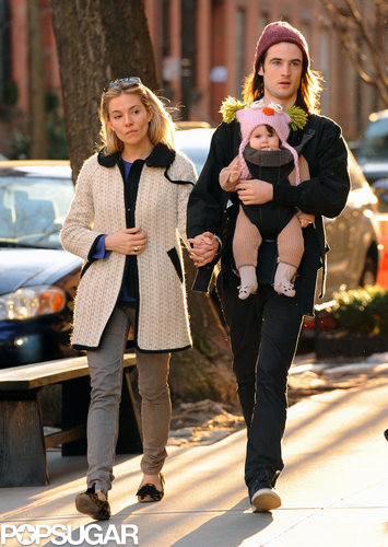 While taking a stroll with Tom Sturridge and their baby girl, Marlowe, Sienna mixed prints in her leopard loafers and striped jeans. She then bundled up in a knit coat and a bright blue sweater.
While taking a stroll with Tom Sturridge and their baby girl, Marlowe, Sienna mixed prints in her leopard loafers and striped jeans. She then bundled up in a knit coat and a bright blue sweater.