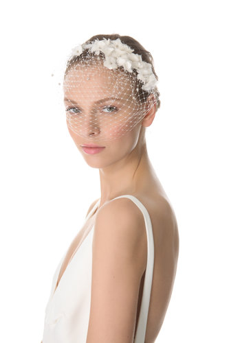 Jenny Packham's May veil ($648) features a barely-there mesh front and frayed silk floral detailing along the headband.
Jenny Packham's May veil ($648) features a barely-there mesh front and frayed silk floral detailing along the headband.