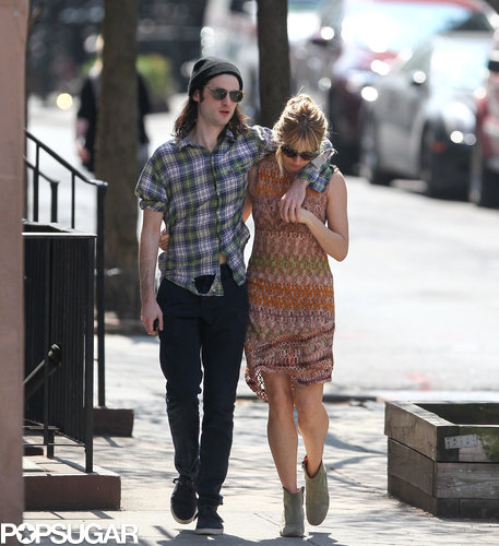 Tom Sturridge and Sienna Miller cuddled up while walking through NYC on Wednesday.
Tom Sturridge and Sienna Miller cuddled up while walking through NYC on Wednesday.