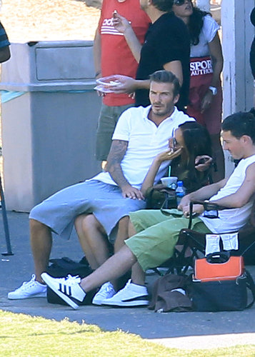 David Beckham snuggled up in Victoria's lap while they watched their boys play soccer in LA in September 2012.
David Beckham snuggled up in Victoria's lap while they watched their boys play soccer in LA in September 2012.