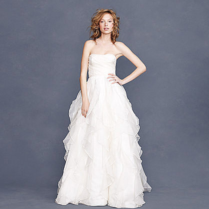Want to have a princess moment? Then definitely hop on this J.Crew strapless silk organza ruffle gown ($2,400). We recommend adding a jewelry belt for an even more glitzy vibe.
Want to have a princess moment? Then definitely hop on this J.Crew strapless silk organza ruffle gown ($2,400). We recommend adding a jewelry belt for an even more glitzy vibe.