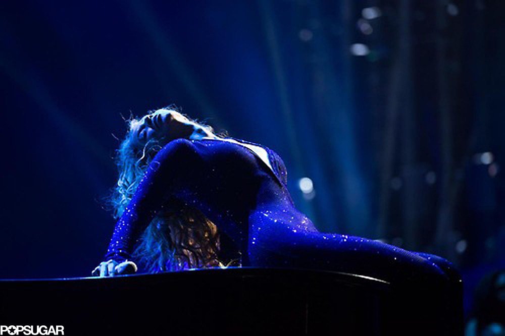 The singer arched her back in her purple sequined jumpsuit.
The singer arched her back in her purple sequined jumpsuit.
