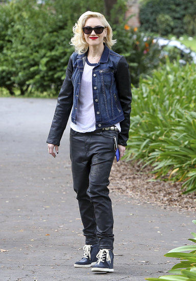 Gwen Stefani was slick in a leather-sleeved denim jacket by Paige Premium Denim, matching black leather baggy jeans, a baseball tee, and high-top sneakers.
Gwen Stefani was slick in a leather-sleeved denim jacket by Paige Premium Denim, matching black leather baggy jeans, a baseball tee, and high-top sneakers.