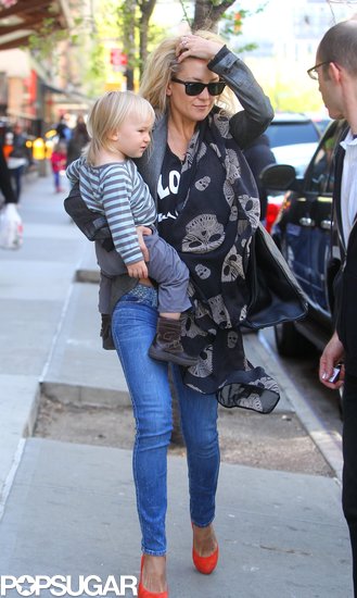 Kate Hudson swept her hair back as she got in the car in NYC. Kate Hudson swept her hair back as she got in the car in NYC.