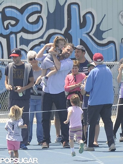 Ben Affleck congratulated daughter Seraphina at the finish line of her track meet.
Ben Affleck congratulated daughter Seraphina at the finish line of her track meet.