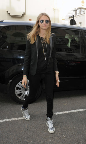 Cara Delevingne channeled Ozzy Osbourne in her round metal sunglasses in London. Her all-black ensemble, including Saint Laurent blazer, got a pop of shine thanks to her silver metallic high-top sneakers.
Cara Delevingne channeled Ozzy Osbourne in her round metal sunglasses in London. Her all-black ensemble, including Saint Laurent blazer, got a pop of shine thanks to her silver metallic high-top sneakers.