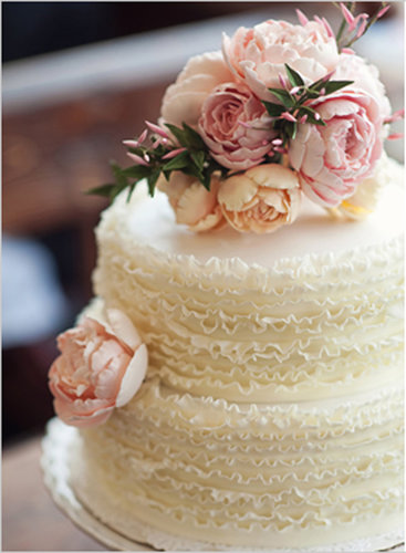 There's something so sweet about this simple but beautiful cake — the ruffles and flowers make a perfectly classic combo.
Photo by Oh, Darling! via Wedding Chicks
There's something so sweet about this simple but beautiful cake — the ruffles and flowers make a perfectly classic combo.
Photo by Oh, Darling! via Wedding Chicks