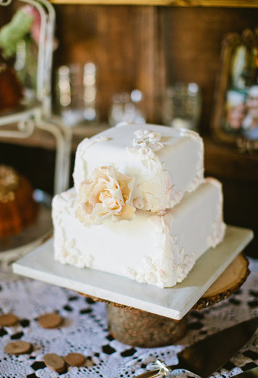 At only two layers high, this pretty white floral-covered cake makes a big impact.
Photo by Sarah Layne Photography via 100 Layer Cake
At only two layers high, this pretty white floral-covered cake makes a big impact.
Photo by Sarah Layne Photography via 100 Layer Cake