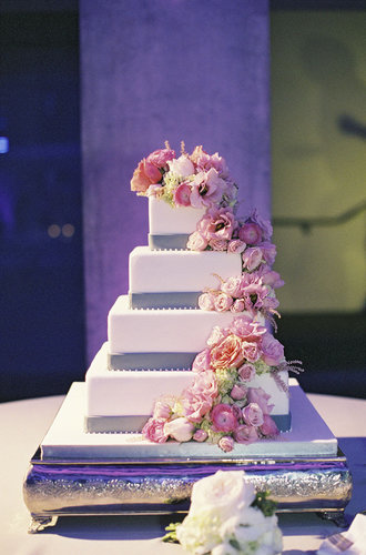 The cascading flowers, purple accents, and four tiers of pretty make this one showstopping cake.
Photo by Caroline Tran Photography via Style Me Pretty
The cascading flowers, purple accents, and four tiers of pretty make this one showstopping cake.
Photo by Caroline Tran Photography via Style Me Pretty