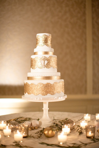 A wedding cake like this romantic, gilded version is sure to make the entire room sparkle — and who doesn't want that on their wedding day?
Photo by Jana Williams Photography via 100 Layer Cake
A wedding cake like this romantic, gilded version is sure to make the entire room sparkle — and who doesn't want that on their wedding day?
Photo by Jana Williams Photography via 100 Layer Cake